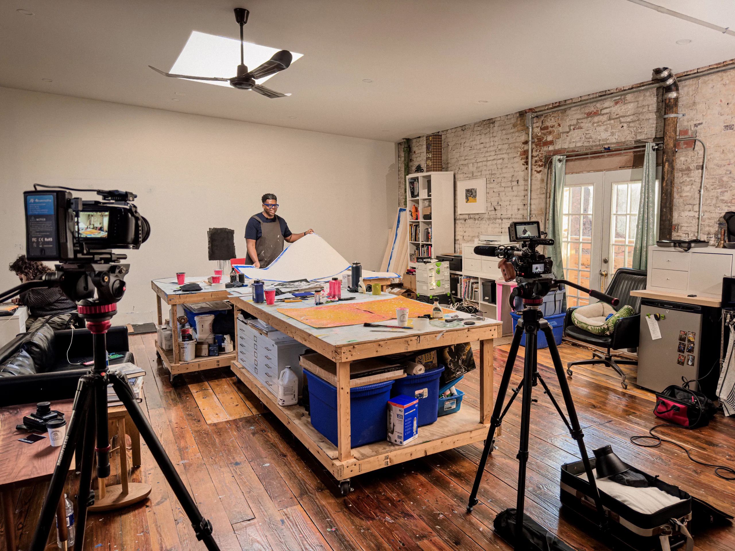 Two cinema cameras record Mark Thomas Gibson working in his studio